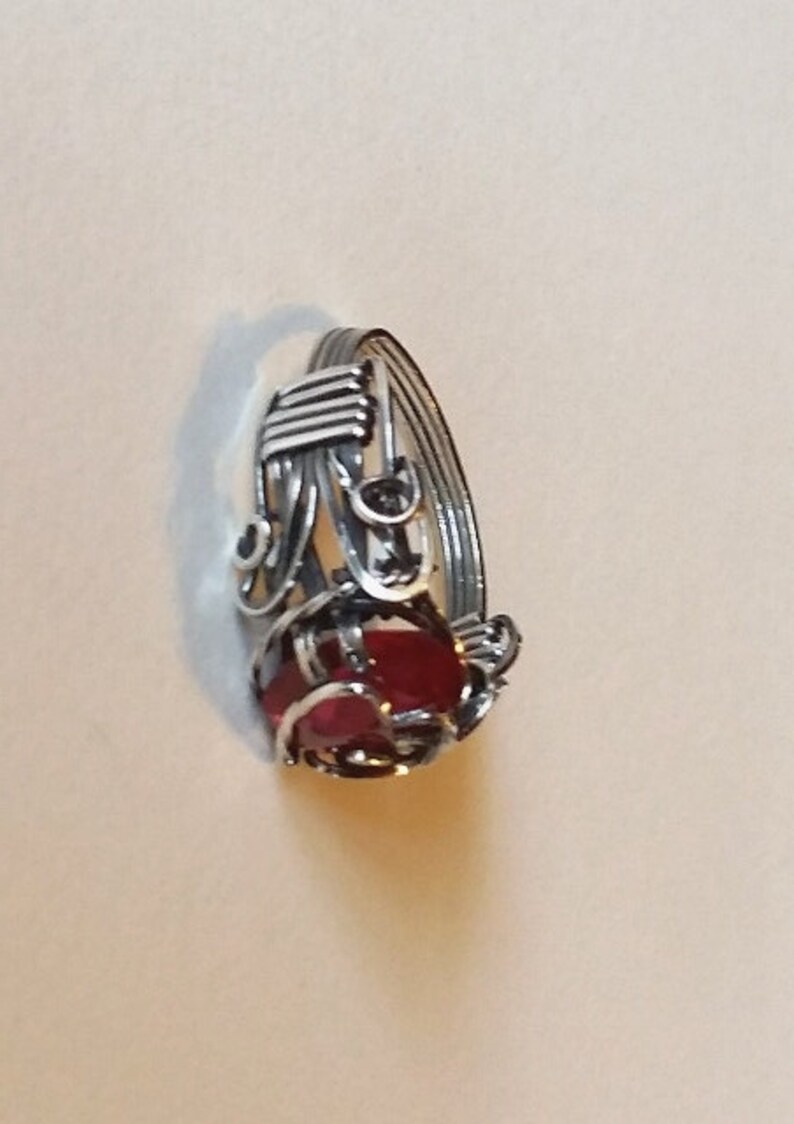 Beautiful Lab created ruby, 12x8mm, is wrapped in sterling silver with antique patina. Prong setting has heart motif in silver. Size 9 1/2 image 3