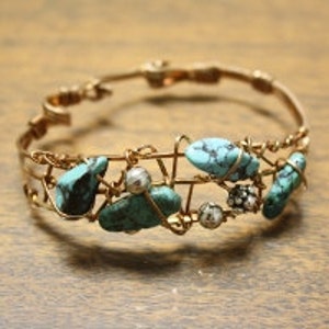 Bronze bracelet cuff wrapping turquoise beads for a stylish look. Fits Medium wrist. image 1