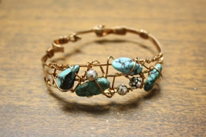 Bronze bracelet cuff wrapping turquoise beads for a stylish look. Fits Medium wrist. image 1