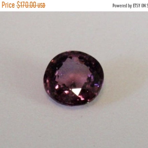 1.5 carat natural spinel, lavender, 7mm round, faceted.  Good color, good saturation, good transparency.  4.5mm deep.