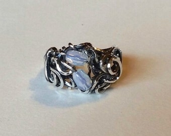 This Sterling Silver Blossom wire ring is one of our most popular rings. Here it has opaline glass beads.