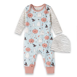 May include: A blue and pink baby onesie with a Halloween theme featuring pumpkins, ghosts, and stars. It comes with a matching striped hat.