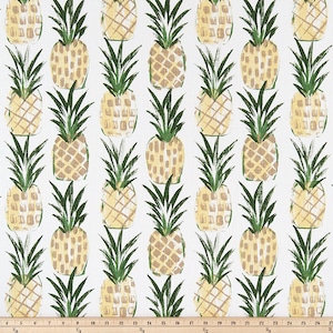 May include: White fabric with a repeating pattern of yellow and tan pineapples with green leaves. The pineapples are arranged in a grid-like fashion, creating a tropical design. The fabric is suitable for various craft projects.