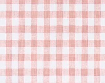 May include: Pink and white gingham fabric with a subtle texture. The fabric is shown on a measuring tape with inch markings.