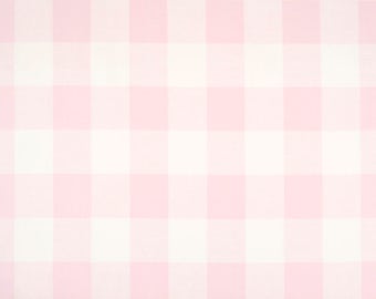 May include: Pink and white gingham fabric. The fabric is a repeating pattern of large squares in a classic check design. A wooden ruler is at the bottom of the image, measuring in inches.