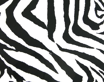 May include: A close-up of a black and white zebra stripe pattern. The pattern features bold, irregular black stripes against a white background. The stripes vary in width and curve across the frame, creating a dynamic and textured appearance.