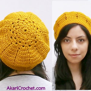 May include: A yellow crocheted beret with a lacy design. The beret is shown on a person's head and from the back.