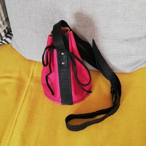 Small pink/black leather shoulder bag