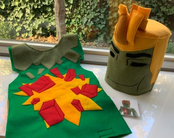 May include: A green felt costume vest with a yellow and red explosion design. A yellow and green felt headpiece with a crown on top.