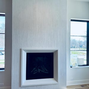 Make-over open haard zelf: zelfstudie gekamde graniettextuur