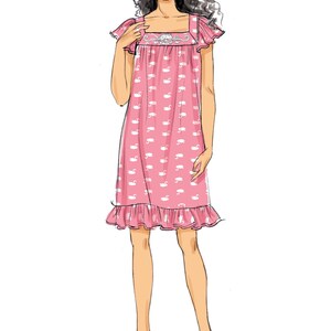 May include: A pink nightdress featuring a white swan pattern. The square neckline and sleeves are trimmed with frills. The hemline also has a frill. The nightdress is knee-length. The model is wearing white flats.