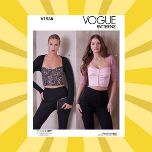 May include: Vogue Patterns sewing pattern featuring two cropped tops. One top has a leopard print, the other is pink with lace sleeves. The pattern includes the text "V1938" and "CUSTOM FIT".