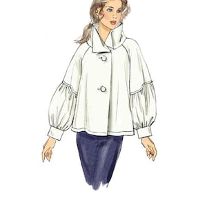 Puede incluir: Ilustraci&oacute;n de una chaqueta blanca con cuello alto y dos botones. La chaqueta tiene mangas largas y abullonadas y se combina con pantalones azul oscuro. Es un boceto de dise&ntilde;o de moda.