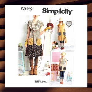May include: Simplicity sewing pattern S9122 featuring three dress designs. The dresses have various details, including floral prints, pockets, and different sleeve lengths. The image also includes the text "dottie angel".