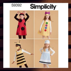 May include: Simplicity sewing pattern S9392 for four children's costumes: a ladybug, a counting toy, a bee, and a bird. Each costume includes a hat and a dress.