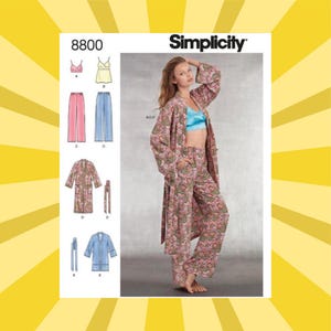 May include: Simplicity sewing pattern 8800 featuring a pajama set with a robe. The model is wearing a blue top and a pink floral pajama set. The pattern includes a robe, pants, and tops. The Simplicity logo is visible in the upper right corner.
