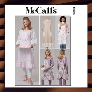 May include: McCall's M8598 sewing pattern featuring aprons in various styles. The aprons include floral and solid designs with ruffle and pocket details. One apron is shown with a tray of cookies.