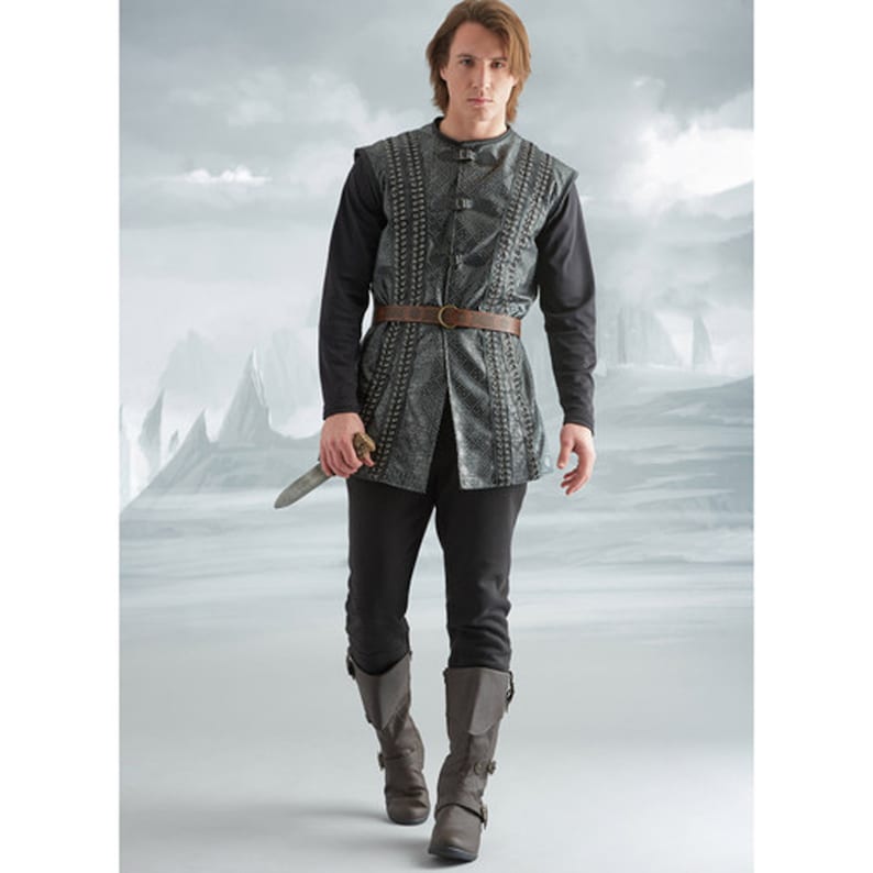 May include: A medieval costume comprising a grey vest with decorative stitching, a brown belt, a black long-sleeved shirt, black trousers, and grey boots. The costume includes a silver dagger. The outfit is designed for a historical or fantasy theme.