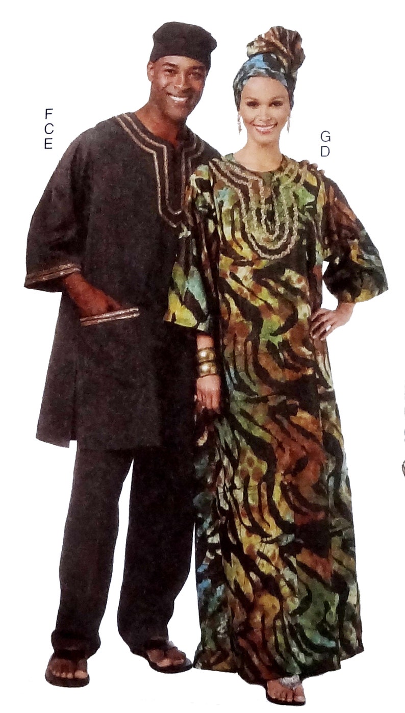 May include: A couple wearing traditional African clothing. The woman is wearing a long, flowing dress with a colorful animal print pattern. The man is wearing a long-sleeved shirt and pants. Both are wearing head coverings.