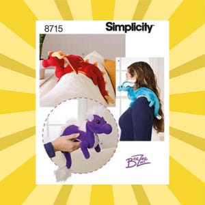 May include: Simplicity pattern 8715 features dragon-shaped plush toys in red, blue, and purple. The image shows the finished plush toys, including one draped over a pillow and another worn on a person's shoulder. The pattern includes instructions for creating these whimsical creatures.