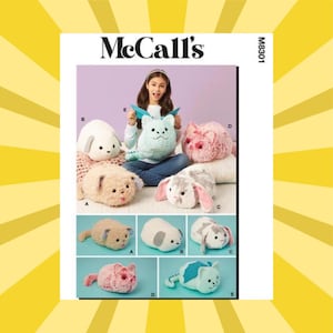 May include: McCall's M8301 sewing pattern envelope featuring five plush animal designs labeled A through E. The designs include a tan cat, a white dog, a gray and white rabbit, a pink cat, and a light blue dragon with teal wings.
