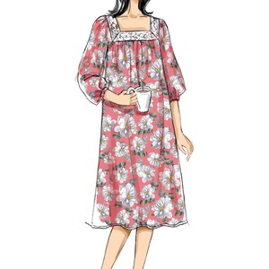 May include: A pink floral nightdress featuring white flowers. The square neckline is trimmed with lace. The three-quarter sleeves and mid-calf length create a comfortable silhouette. A woman is holding a white mug. The nightdress is a comfortable design.