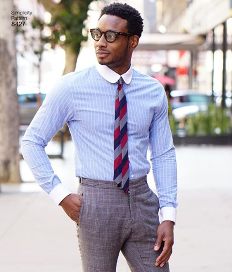 May include: A light blue striped dress shirt with a white collar and cuffs, paired with a patterned tie and gray plaid trousers. The shirt is buttoned up and the tie is knotted. The image also shows a Simplicity Pattern 8427.