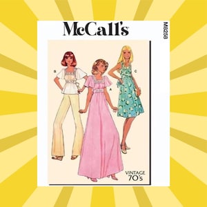 May include: McCall's vintage sewing pattern featuring three women's fashion designs from the 1970s. The designs include a long pink dress, a floral print dress, and a top with pants. The pattern is labeled M8258.
