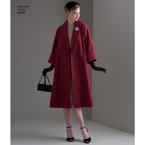May include: A Simplicity Pattern 8509 sewing pattern envelope featuring a deep red, knee-length coat with wide lapels and three-quarter length sleeves. The coat is worn over a beige top, paired with black gloves, a black handbag, and black heels.