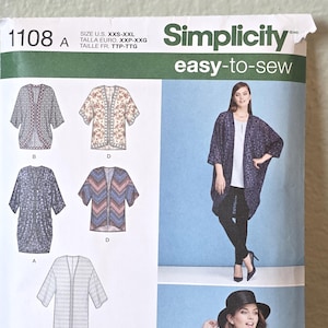 May include: A Simplicity 1108 easy-to-sew pattern envelope for a loose-fitting kimono-style cardigan. The cover displays technical line drawings of four variations and photographs of the garment in different prints, including floral and geometric patterns.