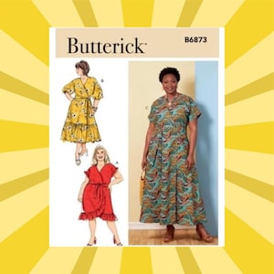 May include: A Butterick sewing pattern, B6873, featuring illustrations of three different dress designs. One dress is yellow with a wrap style, another is red with a ruffled hem, and the third is a teal and orange patterned dress.