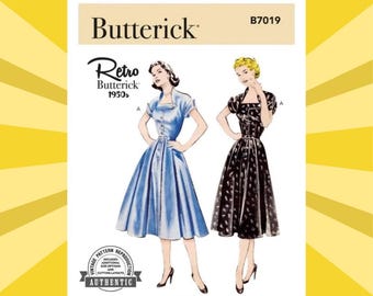 May include: A vintage Butterick sewing pattern, B7019, featuring illustrations of two 1950s-style dresses. One dress is light blue with a button-down front, and the other is black with a floral pattern. The pattern includes size options and cutting layouts.