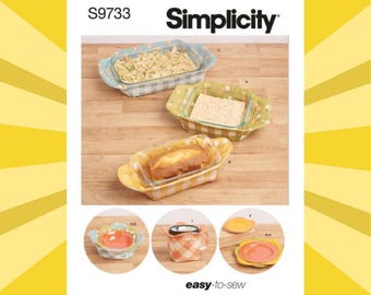 May include: Simplicity pattern S9733 features various baking dishes with gingham fabric covers. The image shows three rectangular glass baking dishes with different fillings, and smaller dishes with lids. The text "easy-to-sew" is also visible.