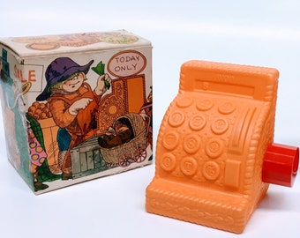 AVON BANK COLLECTIBLE "Ring 'Em Up Clean Non-Tear Shampoo" is in Pretty Orange Plastic Cash Register Shaped Bottle in the Original Avon Box