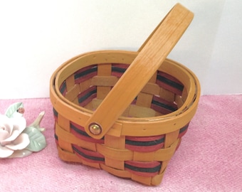 SPLIT WOOD BASKET is a Decorative Tilt Handle 6 1/4" square Country Basket with Dyed Burgundy and Navy Blue Wood Slat Trim and Brass Tacks