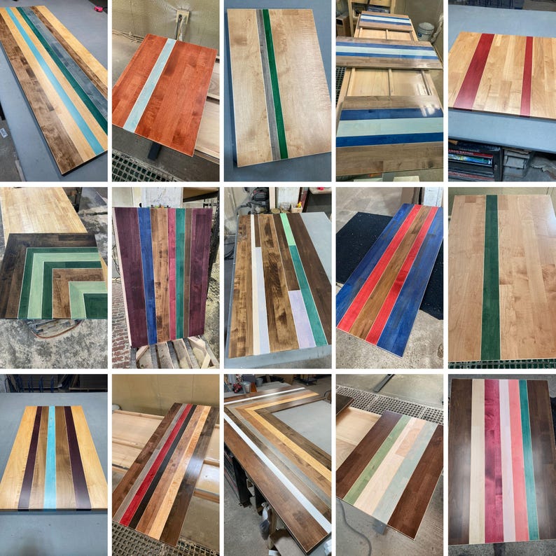 May include: A collection of rectangular wooden panels featuring various inlaid colored resin strips. The designs include vertical, horizontal, and chevron patterns in shades of red, blue, green, purple, and white, showcasing natural wood grain.