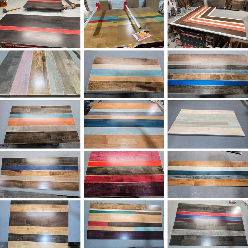 May include: A collection of rectangular wooden tabletops featuring various striped patterns in diverse color combinations including red, blue, orange, and natural wood tones. Each tabletop is constructed from multiple planks joined together.