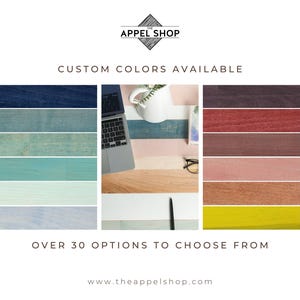 May include: Image displaying a range of custom colour options. The image includes a laptop, a white mug, and a pen on a desk. The text reads "Custom Colours Available" and "Over 30 Options to Choose From."