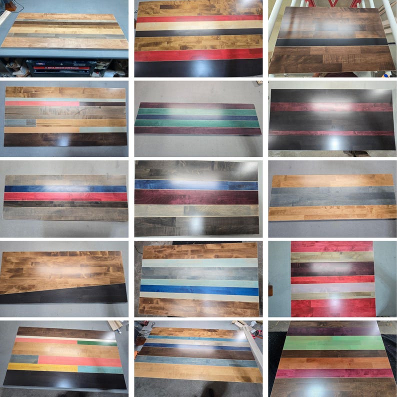 May include: A collection of rectangular wooden boards featuring various horizontal striped patterns in diverse color combinations including red, blue, green, black, and natural wood tones, showcasing smooth finishes and distinct wood grain textures.