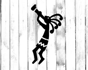 May include: Black and white silhouette of a Kokopelli flute player, a traditional Native American figure, on a white wood background.