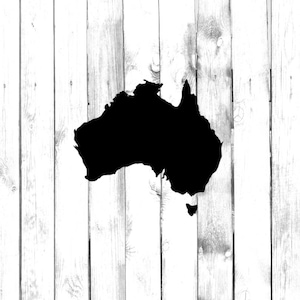 May include: A black silhouette of the continent of Australia on a white wood background.
