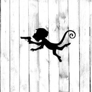 May include: Black silhouette of a monkey holding a gun, with its tail curled around its body. The monkey is facing left and the gun is pointed forward. The image is set against a white woodgrain background.