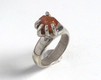 Orange Citrine Ring, Hand holding an Orange Citrine Crystal