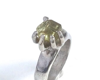 Hand holding a Yellow Tourmaline Stone, Sterling Silver Ring