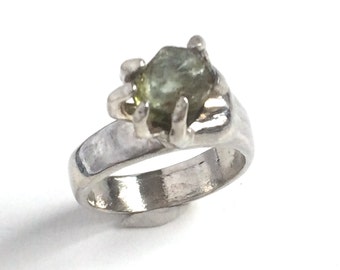 Green Tourmaline Ring, Silver Hand holding a Green Tourmaline Stone