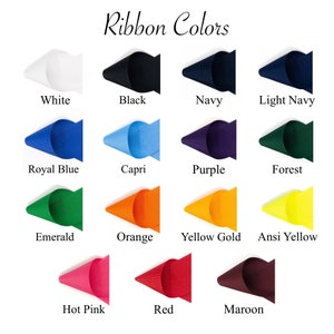 May include: A color chart titled Ribbon Colors displaying fifteen fabric ribbon samples in white, black, navy, light navy, royal blue, capri, purple, forest, emerald, orange, yellow gold, ansi yellow, hot pink, red, and maroon.
