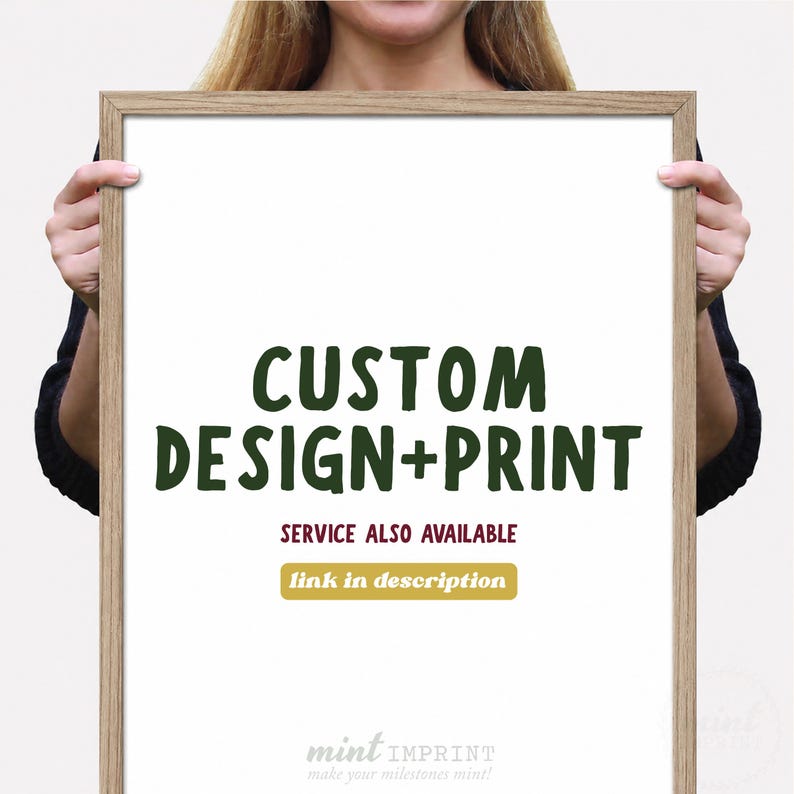 May include: A framed print with the words "CUSTOM DESIGN+PRINT" in dark green. Below, it reads "SERVICE ALSO AVAILABLE" with a gold box that says "link in description". The bottom of the print has the words "mint IMPRINT" and "make your milestones mint!"