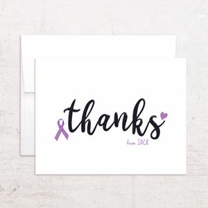 May include: White thank you card with the word "thanks" in black script, a purple awareness ribbon, and a purple heart. The text "from JACK" is below the word "thanks". Includes a white envelope.