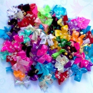 Dog Bows 50 dog grooming bows that are all puppy paw prints! Yorkie Poodle Shih tzu Maltese Lhasa Apso  25 prints Free shipping for USA!