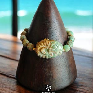 Handcrafted Ram Amulet Bracelet: Turquoise & Gold Beads, Ancient Symbol